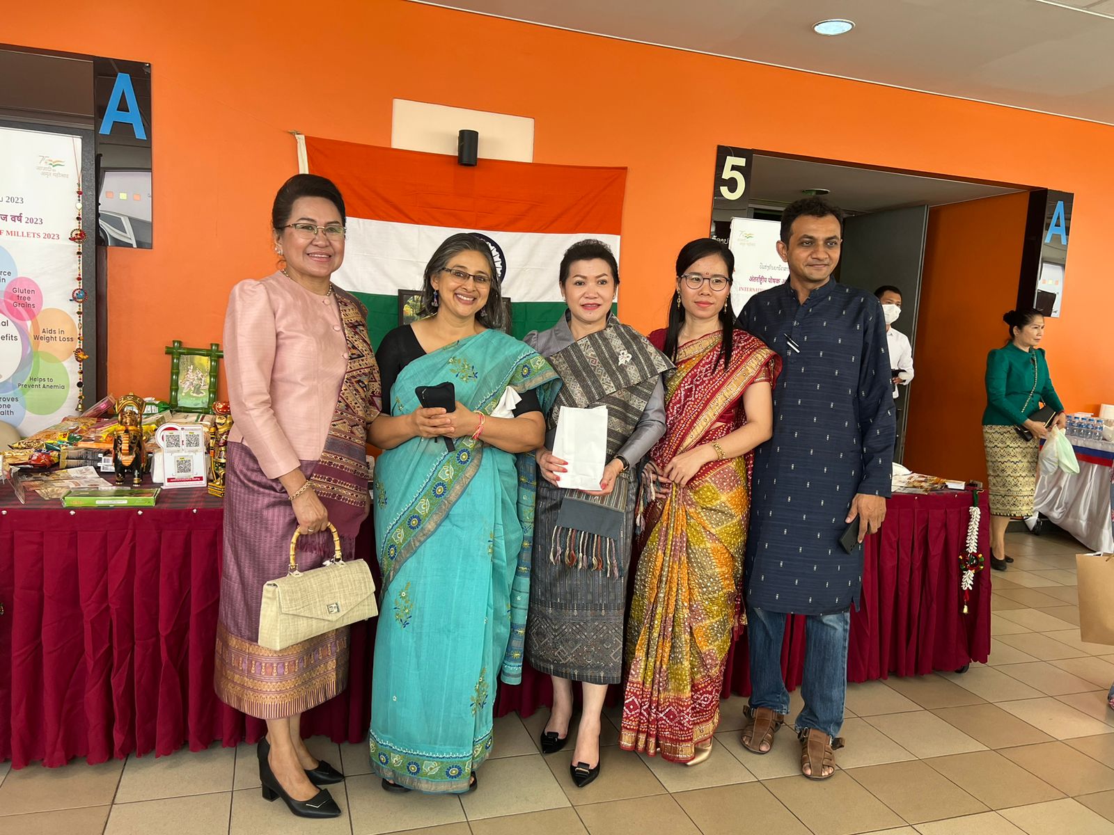 (left to right) Mrs. ViengNgern Khaykhamphithoun (Spouse of the Deputy of Prime Minister), Madam Nidhi Srivastava Asthana, Mrs. Alounny Kommasith a (Spouse of H.E. Mr. Saleumxay KOMMASITH, Deputy Prime Minister, Minister of Foreign Affairs of the Lao PDR) and Indian restaurant owners whose setup a stall to represent Indian Food (including millet dishes) and Artifacts.